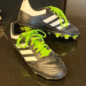 Black and White Adidas Soccer Cleats with Green Laces